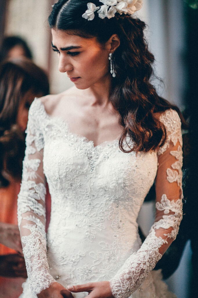 Elegant bride in lace wedding gown during intimate ceremony, photographed by international luxury wedding photographer
